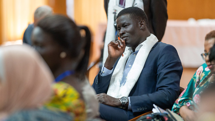 A youth leader listening to His Holiness the Dalai Lama on the second day of conversation with peacebuilders at his residence in Dharamsala, HP, India on October 24, 2019. Photo by Tenzin Choejor