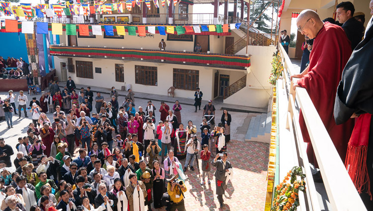 His Holiness the Dalai Lama watching from the balcony as former TIPA artists and members of the public perform songs in the courtyard of the Tibetan Institute of Performing Arts in Dharamsala, India on October 29, 2019. Photo by Tenzin Choejor