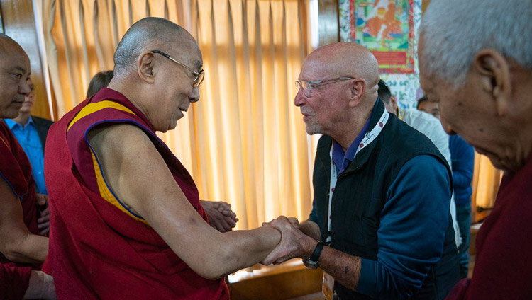 His Holiness the Dalai Lama greeting old friends as he arrives for the first session of the Mind and Life Conversation at his residence in Dharamsala, HP, India on October 30, 2019. Photo by Tenzin Choejor