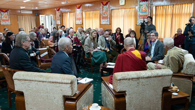 Pariticipants engaging in discsussion after a tea break on the first day of the Mind and Life Conversation with His Holiness the Dalai Lama at his residence in Dharamsala, HP, India on October 30, 2019. Photo by Tenzin Choejor