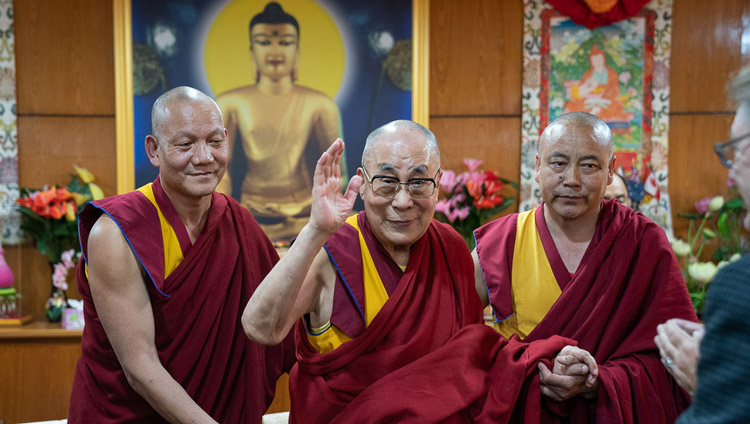 His Holiness the Dalai Lama waving to participants as he prepares to leave the meeting room at the conclusion of the first day of the Mind and Life Conversation at his residence in Dharamsala, HP, India on October 30, 2019. Photo by Tenzin Choejor