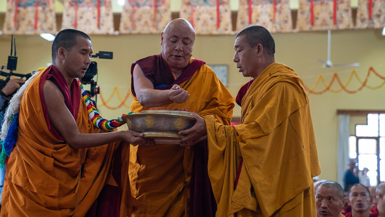 The Chant Master making a mandala offering during the Long Life Offering for His Holiness the Dalai Lama at Gyutö Tantric College in Dharamsala, HP, India on November 2, 2019. Photo by Tenzin Choejor