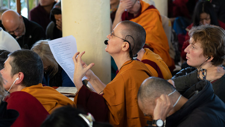 The German language interpreter, one of twelve languages being translated, working during the second day of His Holiness the Dalai Lama's teaching at the Main Tibetan Temple in Dharamsala, HP, India on November 5, 2019. Photo by Ven Tenzin Jamphel