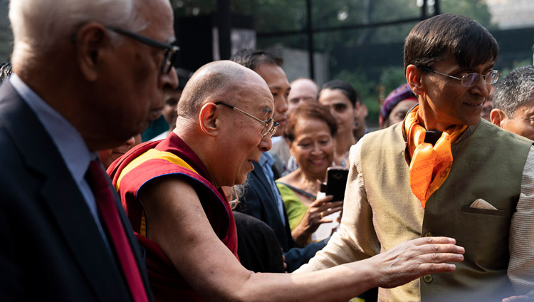 His Holiness the Dalai Lama greeting members of the audience as he departs the stage at the conclusion of the program at the Indian International Centre in New Delhi, India on November 21, 2019. Photo by Tenzin Choejor