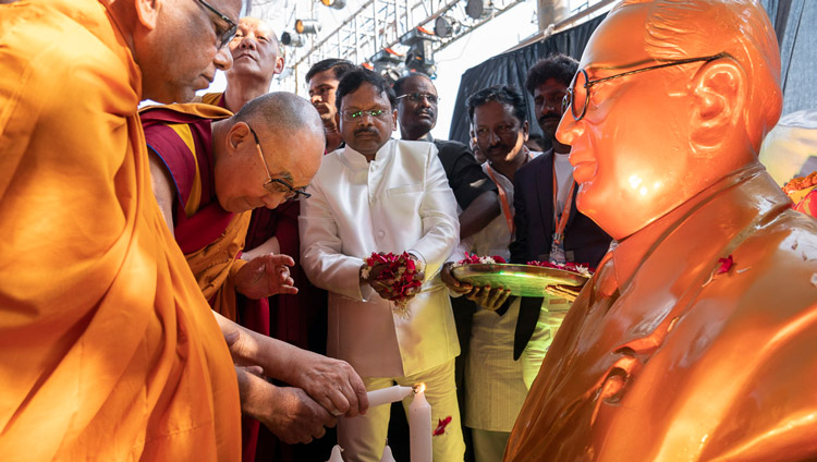 His Holiness the Dalai Lama lighting a lamp in front of an image of Dr Ambedkar before his talk at PES College of Physical Education in Aurangabad, Maharashtra, India on November 24, 2019. Photo by Tenzin Choejor