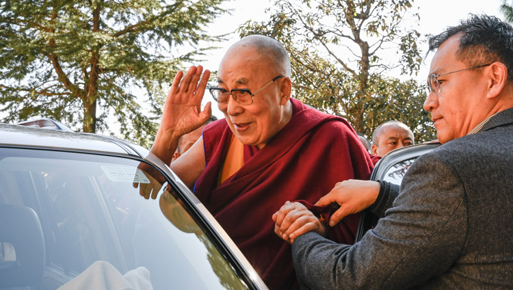 His Holiness the Dalai Lama waving to the crowd as departs for his residence at the conclusion of the inauguration of the Symposium on Monastic Education to mark the 25th anniversary of Kirti Jepa Dratsang in Dharamsala, HP, India on December 7, 2019. Photo by Manuel Bauer