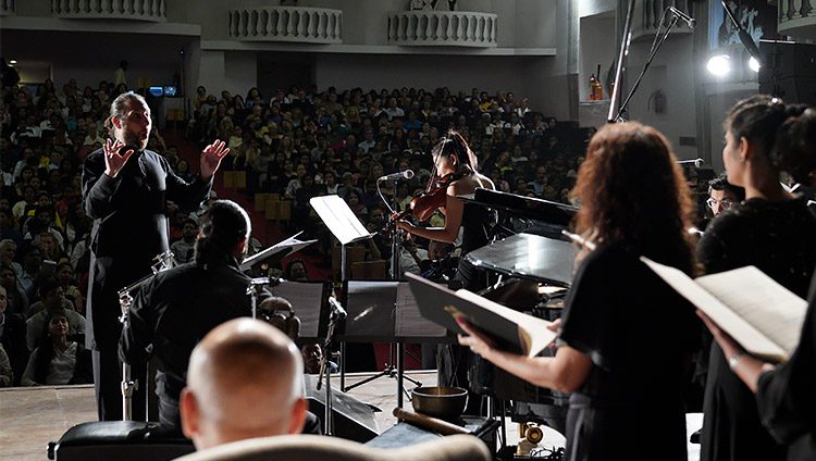 The Goa University choir, accompanied by violin, piano and percussion performing a specially written composition in honor of His Holiness the Dalai Lama before his talk at Kala Academy in Goa, India on December 11, 2019. Photo by Lobsang Tsering