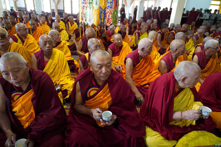 Members of the congregation having tea during ceremonies to welcome His Holiness the Dalai Lama to Drepung Lachi in Mundgod, Karnataka, India on December 12, 2019. Photo by Lobsang Tsering