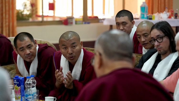 A Tibetan monk who had undergone training in Russia sharing his experiences with His Holiness the Dalai Lama during his discussion with participants in a Russian research program at his residence at Drepung Gomang Monastery in Mundgod, Karnataka, India on December 13, 2019. Photo by Lobsang Tsering