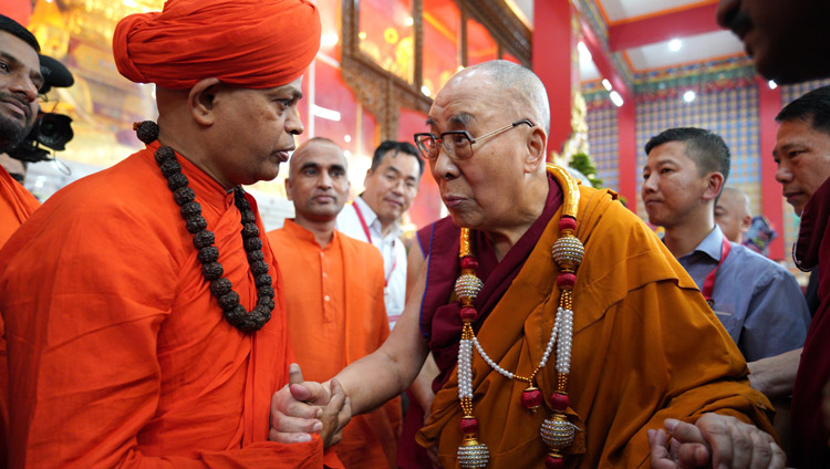 His Holiness the Dalai Lama exchanging a few words with a local Swami who came to meet him at Drepung Loseling Monastery in Mundgod, Karnataka, India on December 15, 2019. Photo by Lobsang Tsering His Holiness the Dalai Lama exchanging a few words with a local Swami who came to meet him at Drepung Loseling Monastery in Mundgod, Karnataka, India on December 15, 2019. Photo by Lobsang Tsering