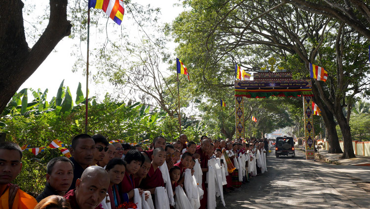 Local people from the surrounding Tibetan settlement lining the road to catch a glimpse of His Holiness the Dalai Lama as he drives from Drepung Monastery to Gaden Monastery in Mundgod, Karnataka, India on December 18, 2019. Photo by Lobsang Tsering