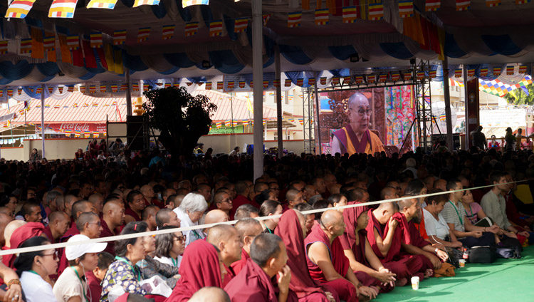 Many of the overflow crowd of 5000 in the courtyard of Gaden Lachi watching His Holiness the Dalai Lama speaking at the International Conference on Je Tsongkhapa at Gaden Lachi in Mundgod, Karnataka, India on December 20, 2019. Photo by Lobsang Tsering