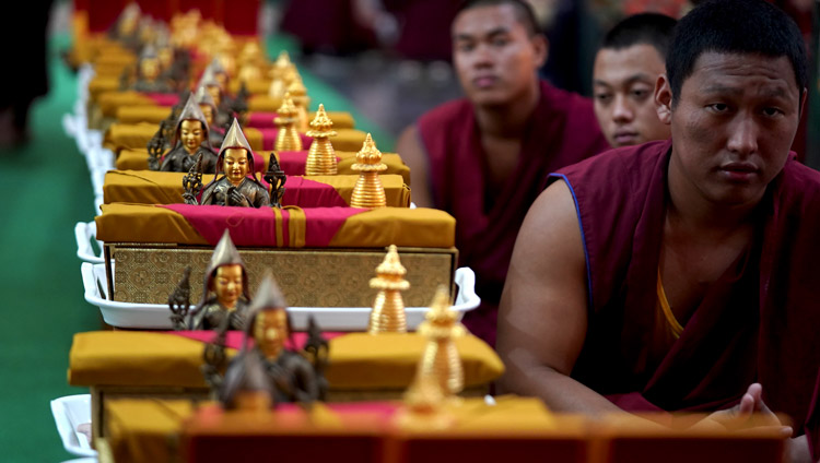 Monks waiting to distribute mementos of the event to guests during the celebration of the 600th anniversary of Jé Tsongkhapa's passing away and enlightenment at Ganden Lachi in Mundgod, Karnataka, India on December 21, 2019. Photo by Lobsang Tsering