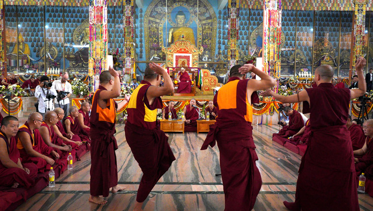 Student monks debating Buddhist philosophy in front of His Holiness the Dalai Lama at the Ganden Jangtsé Assembly Hall in Mundgod, Karnataka, India on December 23, 2019. Photo by Lobsang Tsering