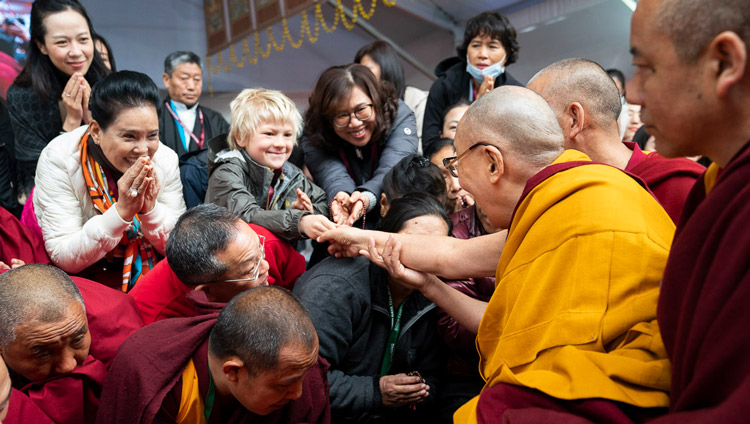 His Holiness the Dalai Lama greeting members of the crowd estimated at 35,000 as he arrives at the Kalachakra Ground in Bodhgaya, Bihar, India on January 2, 2020. Photo by Tenzin Choejor