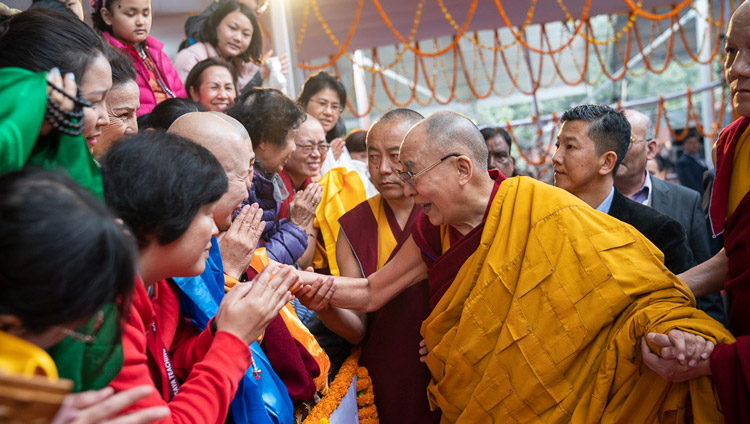 His Holiness the Dalai Lama greeting members of the crowd as he arrives at the Kalachakra Ground in Bodhgaya, Bihar, India on January 5, 2020. Photo by Tenzin Choejor