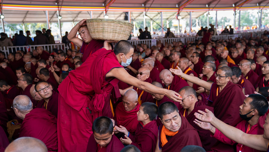 Volunteers distributing longevity pills on the final day His Holiness the Dalai Lama's teachings at the Kalachakra Teaching Ground in Bodhgaya, Bihar, India on January 6, 2020. Photo by Tenzin Choejor