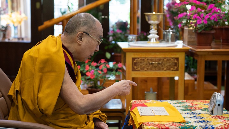 His Holiness the Dalai Lama reading from Tsongkhapa's ‘In Praise of Dependent Arising’ on the first day of his teaching for Tibetan youth from his residence in Dharamsala, HP, India on August 4, 2020. Photo by Ven Tenzin Jamphel