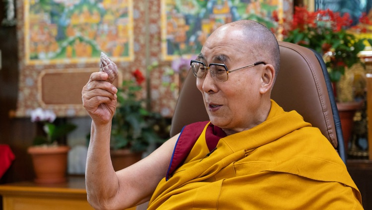 His Holiness the Dalai Lama holding the conch shell he retrieved from the vicinity of a cave in Central India in which Nagarjuna is said to have meditated and which was later visited by the Chinese pilgrim Xuanzang during the first day of his virtual teaching from his residence in Dharamsala, HP, India on October 2, 2020. Photo by Ven Tenzin Jamphel