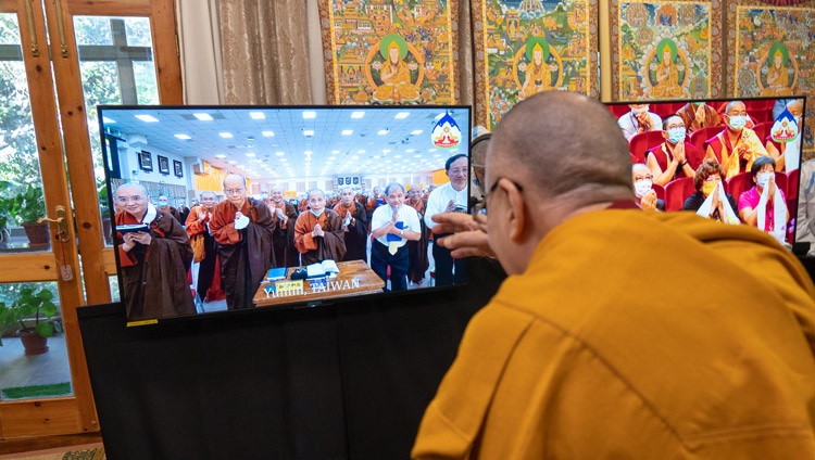 His Holiness the Dalai Lama waving saluting the two groups in the virtual audience as he arrives for the second day of teachings from his residence in Dharamsala, HP, India on October 3, 2020. Photo by Ven Tenzin Jamphel
