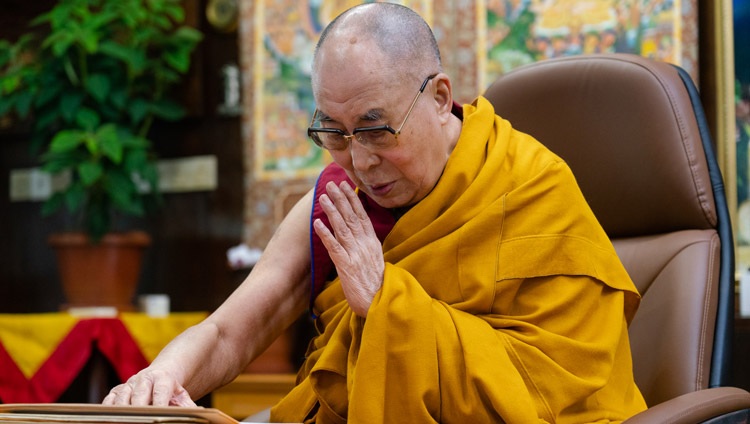 His Holiness the Dalai Lama reading from Tsongkhapa’s ‘Essence of True Eloquence’ on the third day of his virtual teachings from his residence in Dharamsala, HP, India on October 4, 2020. Photo by Ven Tenzin Jamphel