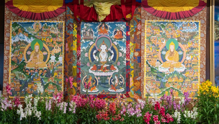 The central figure in these thangka paintings hanging behind His Holiness is the four armed Avalokiteshvara described in the Guru Yoga of Avalokiteshvara, the transmission of which he gave on the final day of his teachings from his residence in Dharamsala, HP, India on January 7, 2021. Photo by Ven Tenzin Jamphel