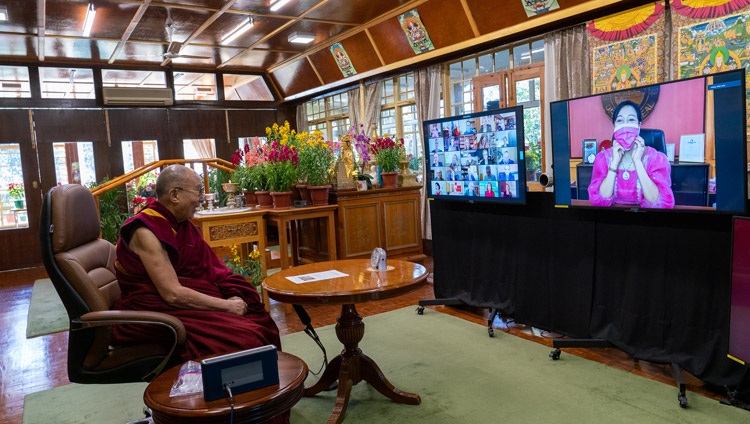 Mayor Maria Isabelle Climaco, Zamboanga, Philippines, playfully putting on her mask as His Holiness the Dalai Lama recommends following the advice of experts, including wearing masks, as he answers her question during their online conversation on Kind and Compassionate Leadership from his residence in Dharamsala, HP, India on January 27, 2021. Photo by Ven Tenzin Jamphel