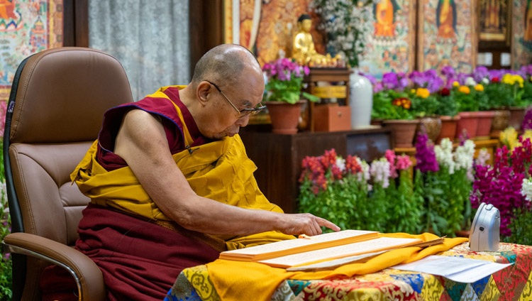 His Holiness the Dalai Lama reading from Nagarjuna's ‘Precious Garland’ during his teachings on the full-moon day of the Great Prayer Festival online from his residence in Dharamsala, HP, India on February 27, 2021. Photo by Ven Tenzin Jamphel