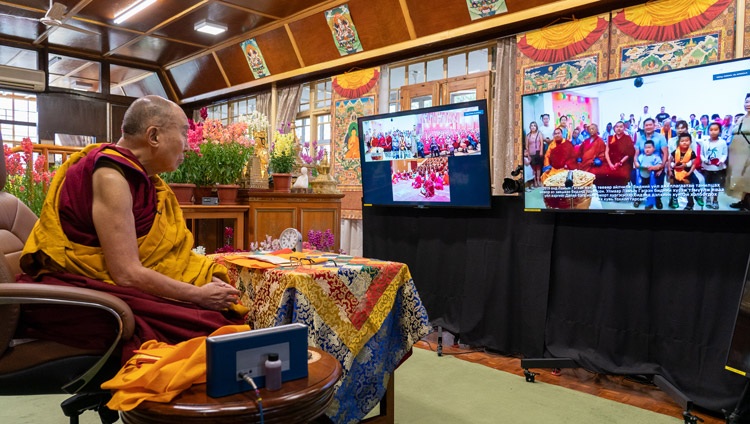 His Holiness the Dalai Lama watching a video about ‘Achlalt khuukhduud’, an orphanage and nursing home in Mongolia during the first day of online teachings from his residence in Dharamsala, HP, India on March 12, 2021. Photo by Ven Tenzin Jamphel