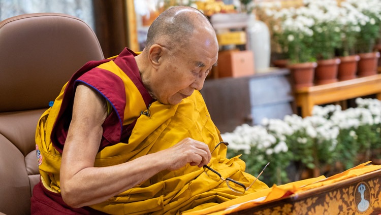 His Holiness the Dalai Lama reading from 'Ornament of Sutras of the Great Vehicle' on the first day of his teachings requested by Russian Buddhists online from his residence in Dharamsala, HP, India on November 4, 2021. Photo by Ven Tenzin Jamphel