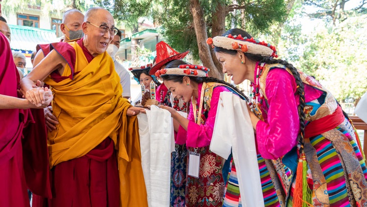 Performers from the Tibetan Institute of Performing Arts welcoming His Holiness the Dalai Lama as he arrives at the courtyard of the Main Tibetan Temple in Dharamsala, HP, India on April 7, 2022. Photo by Tenzin Choejor