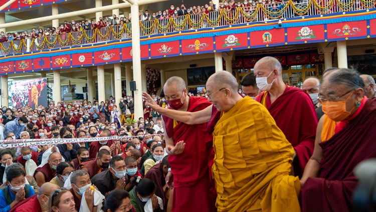 His Holiness the Dalai Lama waving to the crowd gathered in the courtyard of the Main Tibetan Temple as he heads back to his residence at the conclusion of the Long Life Offering in Dharamsala, HP, India on May 25, 2022. Photo by Tenzin Choejor