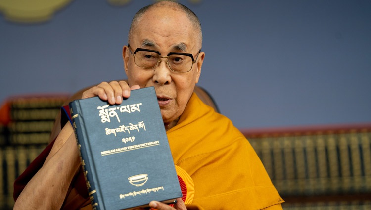 His Holiness the Dalai Lama holding a volume of the Monlam Grand Tibetan Dictionary and the dictionary's launch at the Main Tibetan Temple in Dharamsala, HP, India on May 27, 2022. Photo by Tenzin Choejor