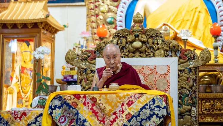 His Holiness the Dalai Lama talking about the Kyirong Jowa statue in the glass case behind him during the first day of his Teachings for Tibetan Youth in Dharamsala, HP, India on June 1, 2022. Photo by Tenzin Choejor