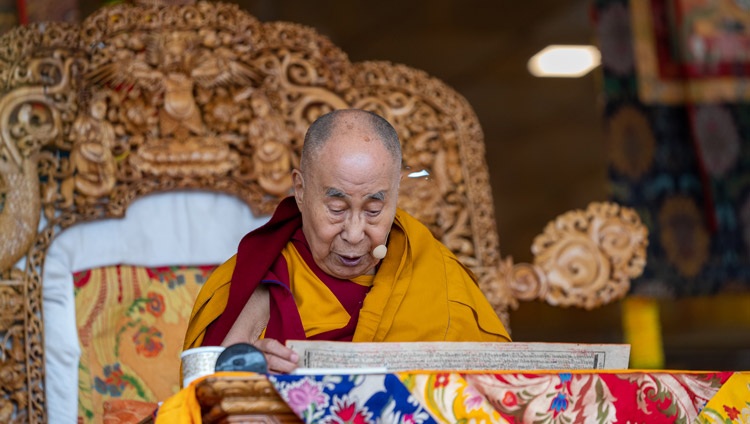 His Holiness the Dalai Lama reading from Shantideva's ‘Entering the Way of a Bodhisattva’ on the second day of teachings at the Shewatsel Teaching Ground in Leh, Ladakh, UT, India on July 29, 2022. Photo by Tenzin Choejor