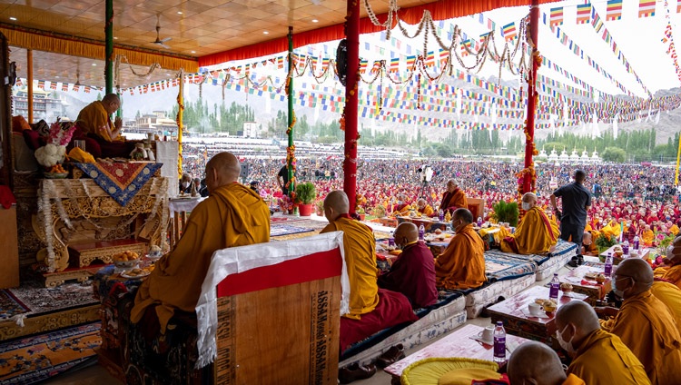 His Holiness the Dalai Lama performing the necessary procedures prior to bestowing the empowerment of Avalokiteshvara at the Shewatsel Teaching Ground in Leh, Ladakh, UT, India on July 30, 2022. Photo by Tenzin Choejor