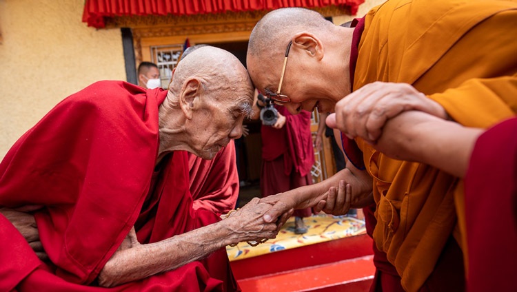 His Holiness the Dalai Lama exchanging greetings with former Gaden Tripa, His Eminence Rizong Rinpoché, on his arrival at Rinpoché's residence in Leh, Ladakh, UT, India on August 25, 2022. Photo by Tenzin Choejor