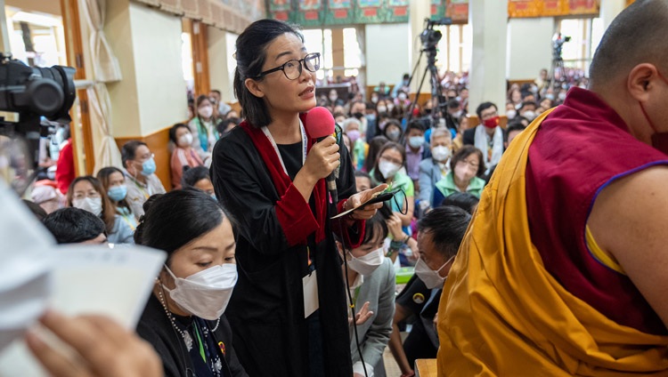 A member of the audience asking His Holiness the Dalai Lama a question on the second day of his teachings at the Main Tibetan Temple Dharamsala, HP, India on September 16, 2022. Photo by Tenzin Choejor