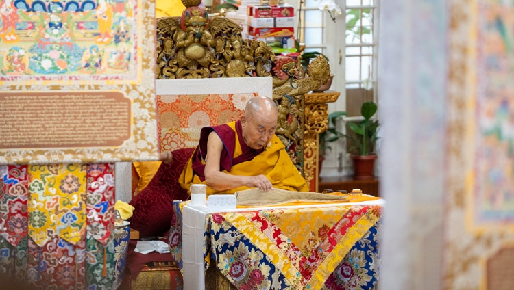 His Holiness the Dalai Lama reading from the ‘Commentary on Valid Cognition’ on the second day of teachings at the Main Tibetan Temple in Dharamsala, HP, India on October 4, 2022. Photo by Tenzin Choejor