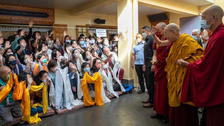 His Holiness the Dalai Lama waving to members of the audience from Taiwan as he departs at the conclusion of the second day of teachings at the Main Tibetan Temple in Dharamsala, HP, India on October 4, 2022. Photo by Tenzin Choejor