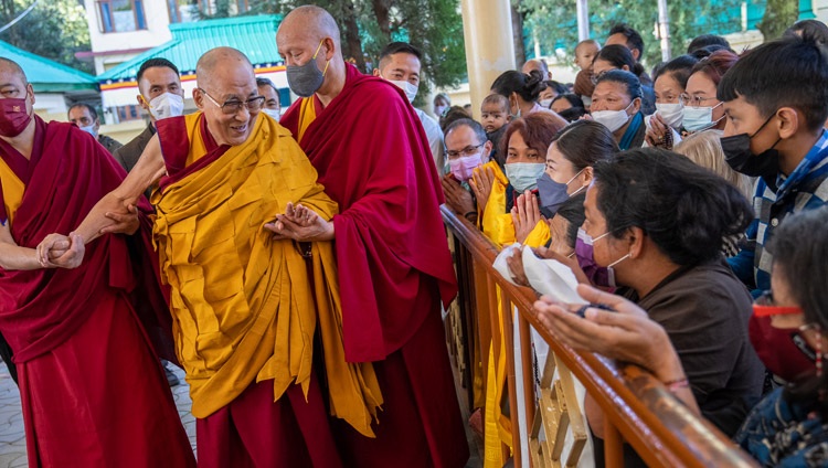 His Holiness the Dalai Lama greeting members of the crowd attending the third day of teachings as he arrives at the Main Tibetan Temple in Dharamsala, HP, India on October 5, 2022. Photo by Tenzin Choejor