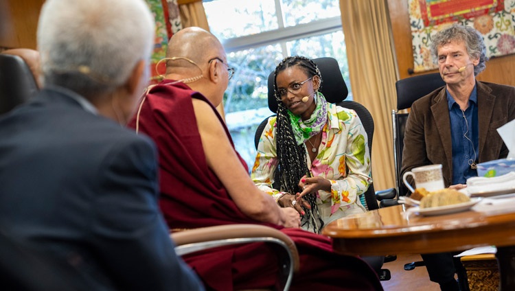 The day's moderator Martijn van Beek looking on as Abeba Birhane, whose work focuses on AI, artificial intelligence, delivers her presentation on the second day of the Mind & Life Conversation on Interdependence, Ethics and Social Networks at His Holiness the Dalai Lama's residence in Dharamsala, HP, India on October 13, 2022. Photo by Tenzin Choejor