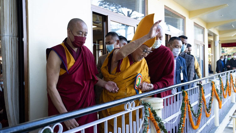 His Holiness the Dalai Lama waving to members of the public on the street below on his way to the Main Tibetan Temple to attend a Long Life Prayer in Dharamsala, HP, India on October 26, 2022. Photo by Tenzin Choejor