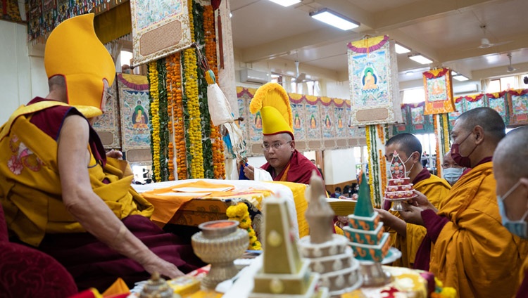 Ling Rinpoché presenting traditional offerings to His Holiness the Dalai Lama during the Long Life Prayer at the Main Tibetan Temple in Dharamsala, HP, India on October 26, 2022. Photo by Tenzin Choejor