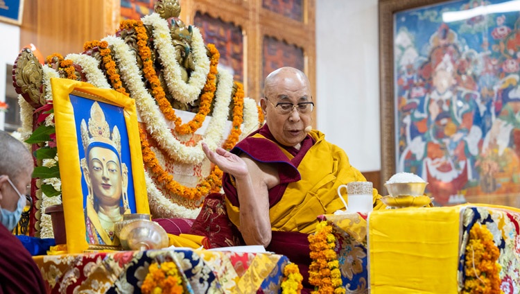His Holiness the Dalai Lama gesturing towards a photograph of the Chenrezig Wati Sangpo statue that he keeps in his residence during the Long Life Offering ceremony at the Main Tibetan Temple in Dharamsala, HP, India on November 30, 2022. Photo by Tenzin Choejor