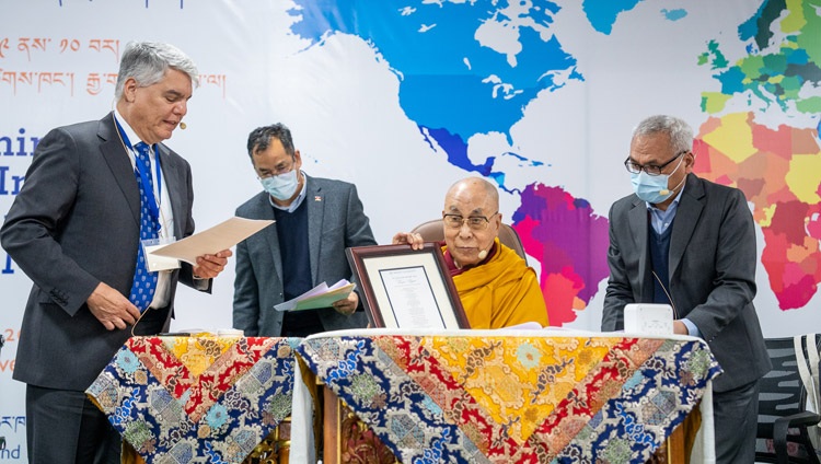Emory University President Gregory L. Fenves presenting a citation to His Holiness the Dalai Lama in recognition of his fifteen years as Presidential Distinguished Professor at Emory University during the inaugural session of the SEE Learning Conference at the Dalai Lama Library & Archive in Dharamsala, HP, India on December 9, 2022. Photo by Tenzin Choejor