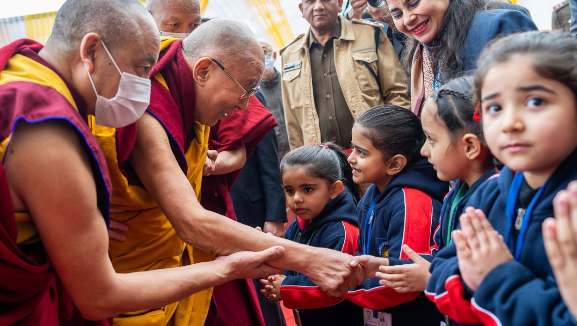His Holiness the Dalai Lama greeting students on his arrival at Salwan Public School in Gurugram, India on December 21, 2022. Photo by Tenzin Choejor