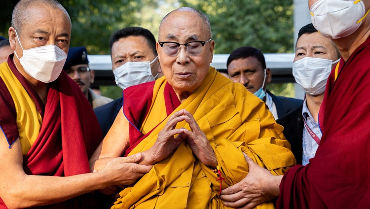 His Holiness the Dalai Lama in a short moment of quiet prayer as he walks through the Mahabodhi Temple grounds in Bodhgaya, Bihar, India on December 23, 2022. Photo by Tenzin Choejor