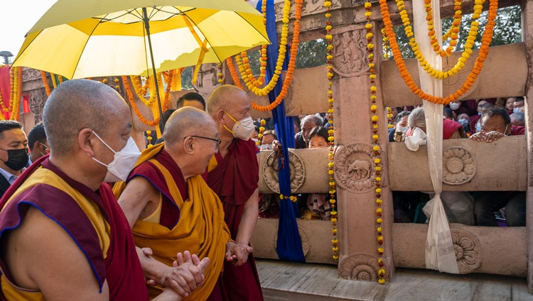His Holiness the Dalai Lama greeting the devout gathered at the Mahabodhi Temple in Bodhgaya, Bihar, India on December 23, 2022. Photo by Tenzin Choejor