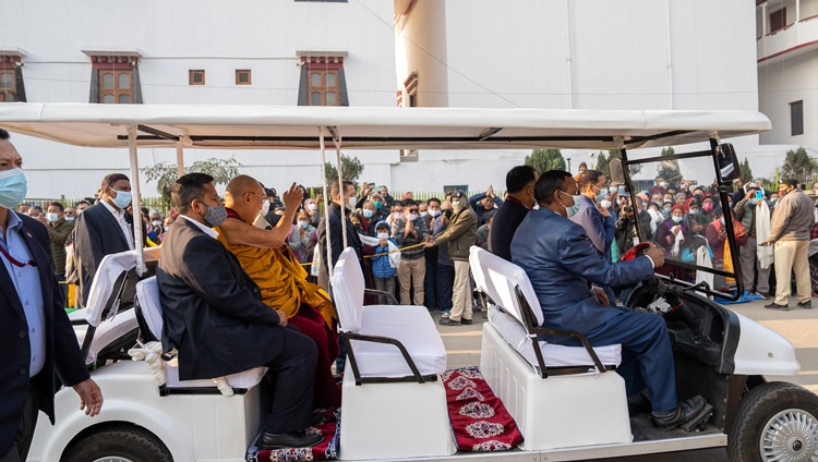 His Holiness the Dalai Lama waving to well-wishers gathered on road to the Kalachakra Teaching Ground in Bodhgaya, Bihar, India on December 29, 2022. Photo by Tenzin Choejor